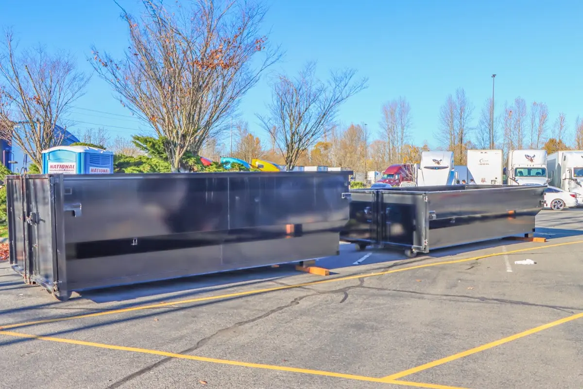 Professional dumpster rental service with roll-off container on residential driveway in Lincolnwood